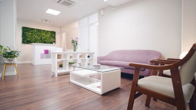 Dental waiting lounge with reception and a vertical garden