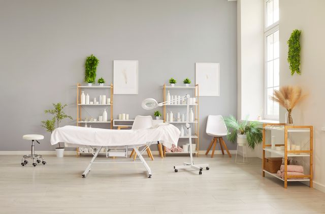 Dermatology treatment suite with natural daylight and warm neutral finishes