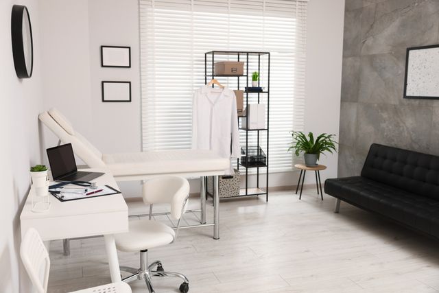 Compact consultation room with examination couch and patient seating