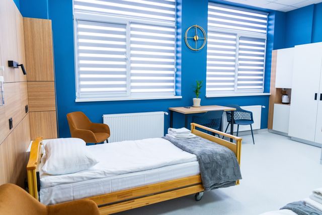 Private recovery room with warm timber storage and visitor seating