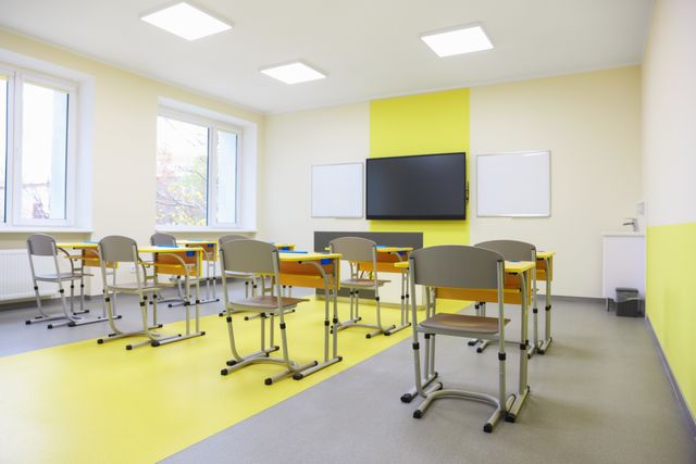 Bright classroom with flexible desks and teaching display
