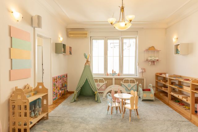 Montessori activity room with child-height furniture and natural finishes