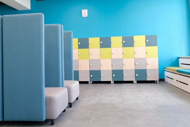 School breakout area with acoustic seating and colourful storage lockers